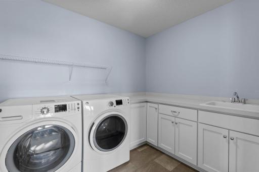 Oversized laundry room with storage