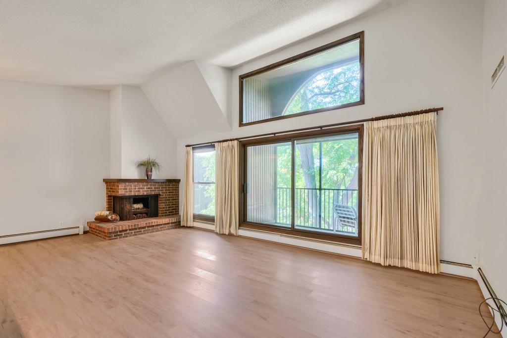 Coveted 3rd floor location with vaulted ceilings and abundant windows to fill the space with natural light. Brand new flooring installed throughout home.