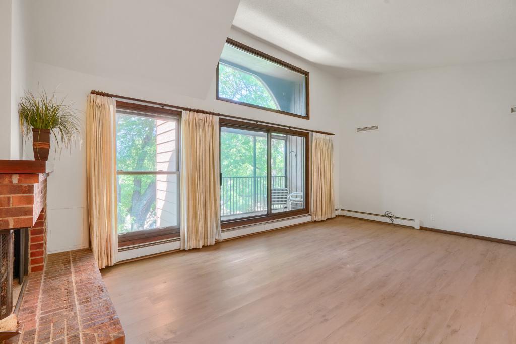 Airy and bright living room with new flooring, fresh paint and tons of light! Move in ready home!