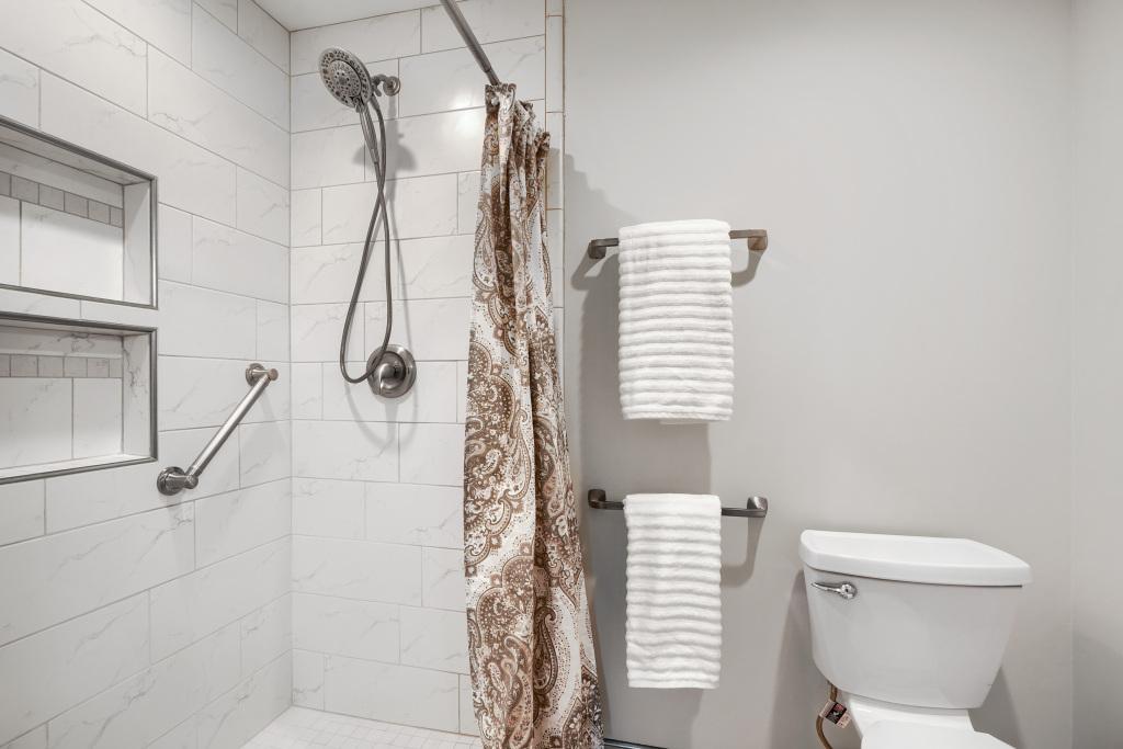 Updated bath with gorgeous tile work...