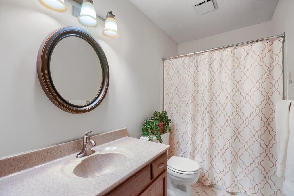 Full bathroom with nice vanity and tile flooring. Home is in immaculate condition.