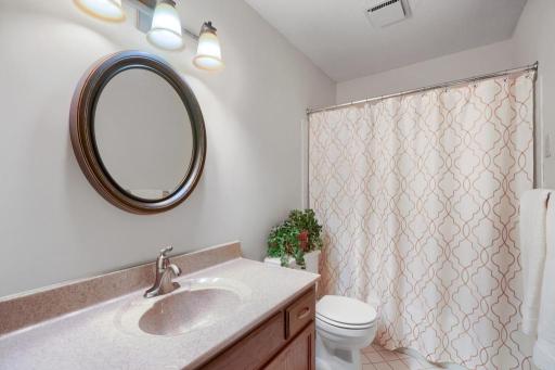 Full bathroom with nice vanity and tile flooring. Home is in immaculate condition.