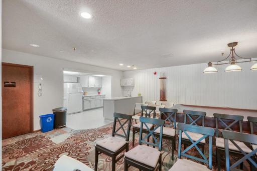 Community room has a full kitchen, access to a guest suite for overnight guests and a patio for outdoor use. A fantastic feature of the building.