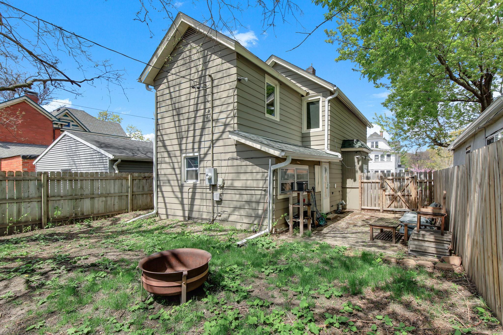Yard fully fenced in with patio area