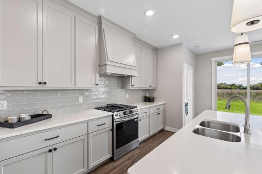 Gourmet kitchen with all custom to-the-ceiling cabinets