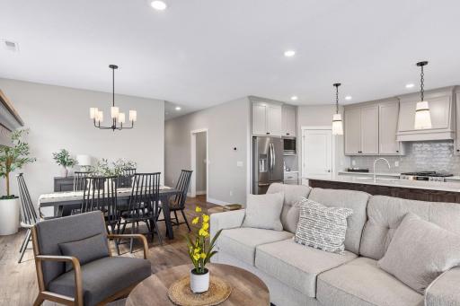 Bright, inviting living space featuring a modern kitchen, informal dining and living room
