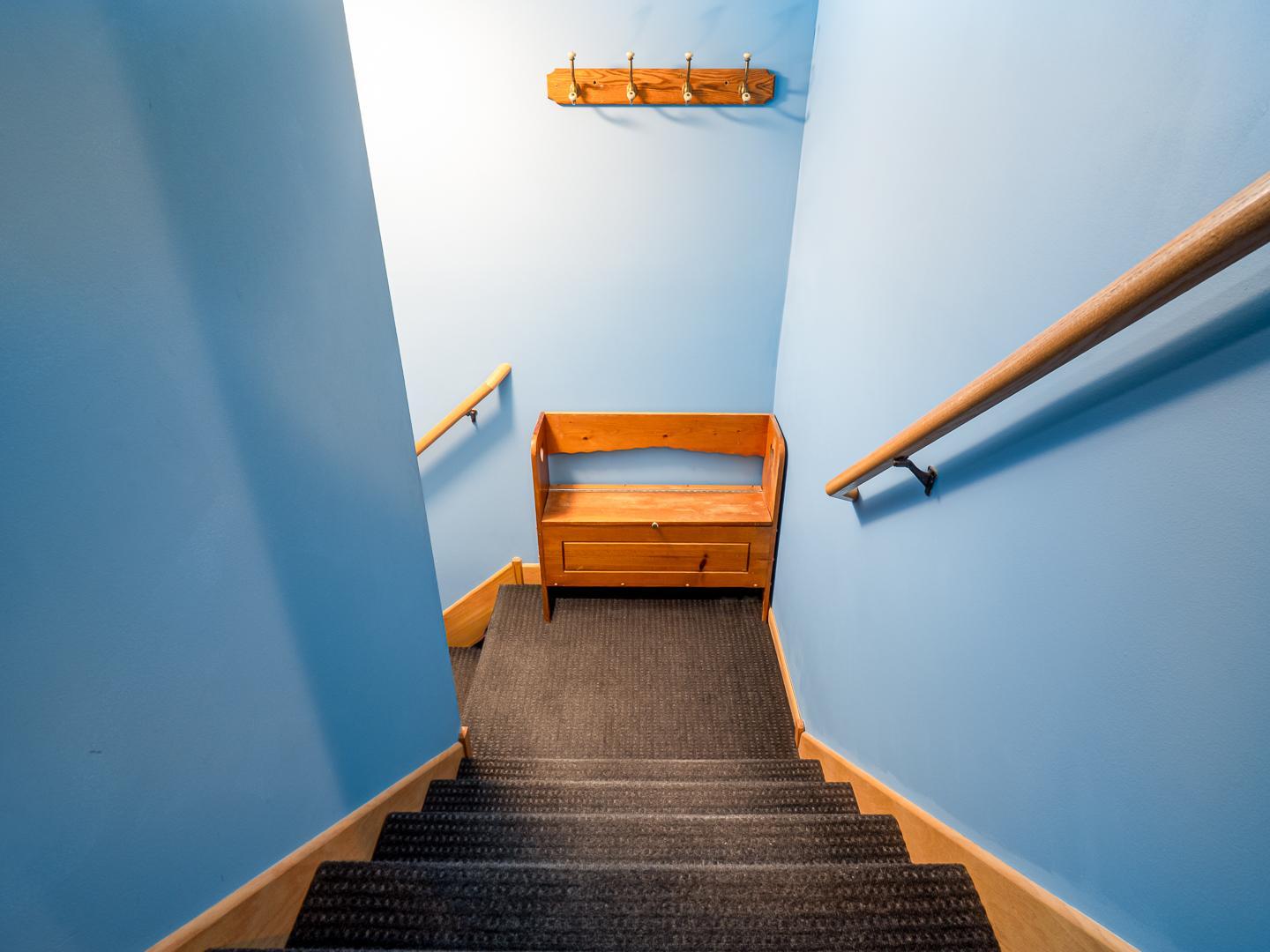 Stairs to garge and bonus room off the kitchen.