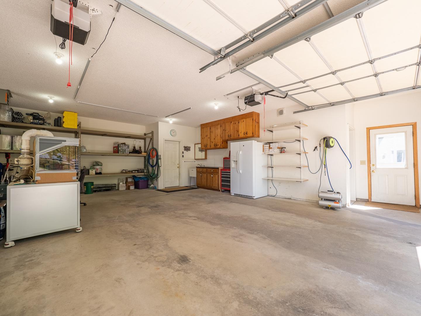 Another view of the garage with door leading to the living space.