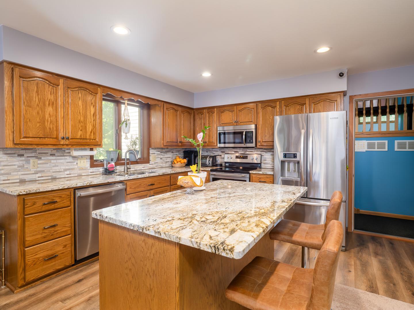 Recently remodeled Kitchen features center island and snack bar.