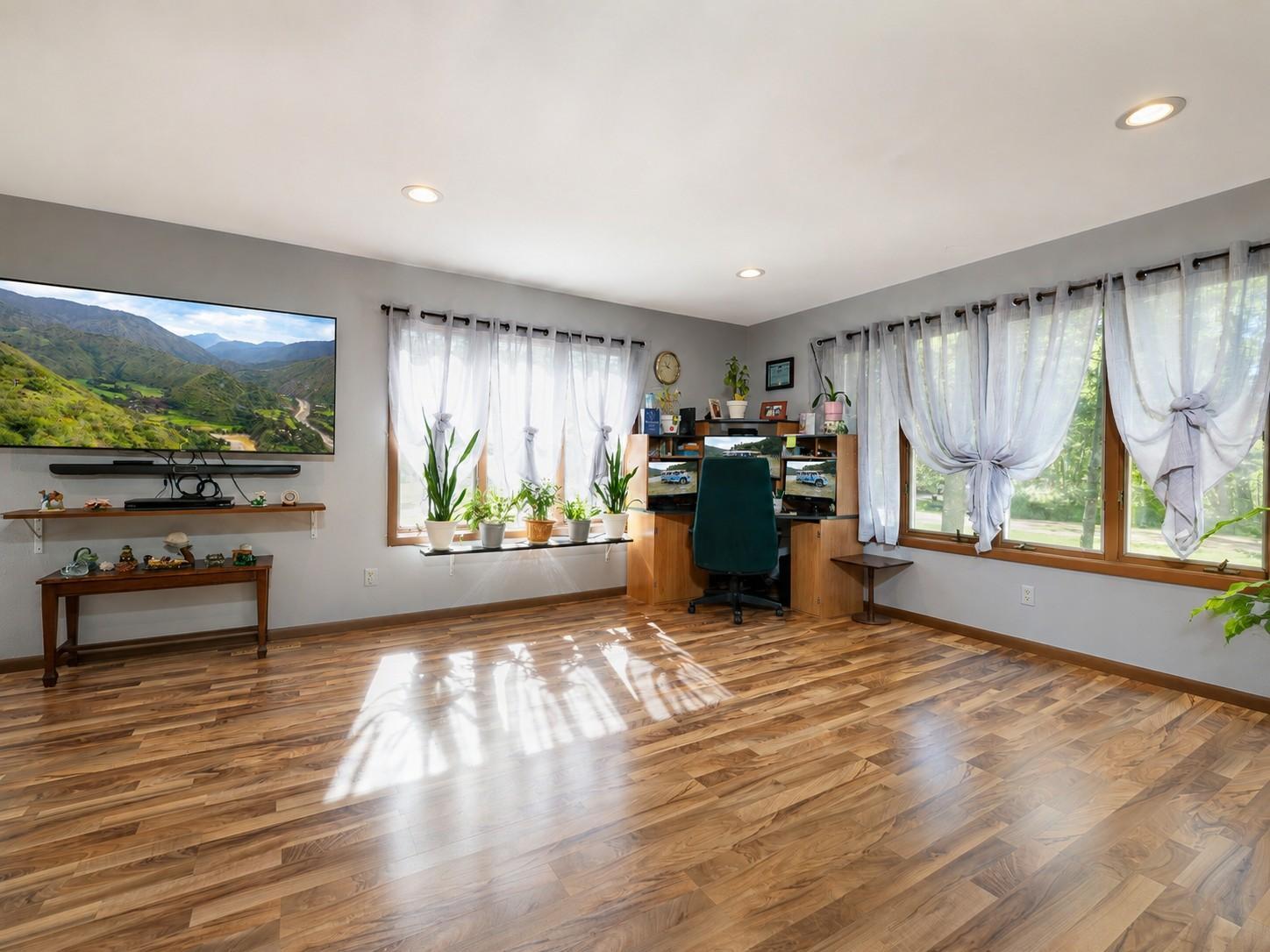 Spacious living room with loads of natural light.