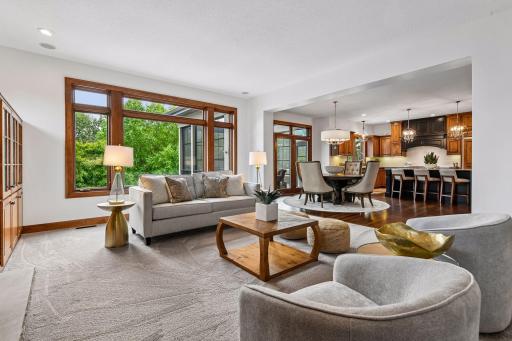Sophisticated open-concept living blends seamlessly with designer entertaining spaces, featuring walls of windows, rich hardwood floors, and refined finishes throughout. Ideal for hosting or relaxing, this home offers luxury spaces.