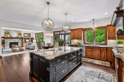 Entertain with ease in this stunning open-concept design, where a gourmet kitchen flows seamlessly into inviting living spaces then into heated sunporch with incredible backyard private views and heated pool.