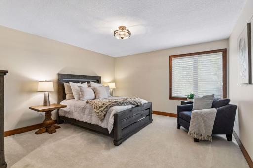 Spacious secondary bedroom offering comfort, privacy, and abundant natural light. Thoughtfully positioned adjacent to a convenient pass-through full bath, creating an ideal guest or family suite. A welcoming retreat designed for both everyday living.