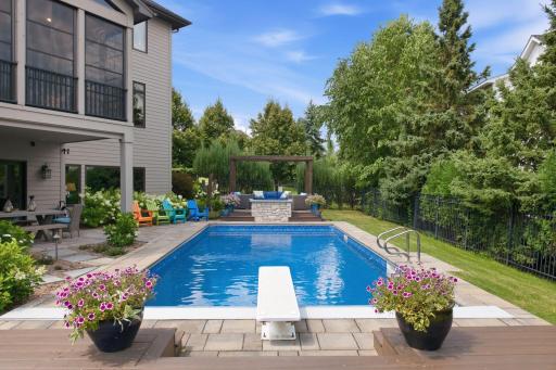 Copilot said: Resort-style outdoor living awaits in this private backyard oasis, featuring a sparkling in-ground pool, expansive patios, lush landscaping, and multiple areas for lounging and entertaining. Designed for unforgettable summer gatherings