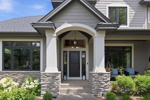Make a lasting first impression with this stunning custom exterior, featuring timeless architecture, stone accents, and a grand covered entry. Surrounded by mature landscaping and exceptional curb appeal.