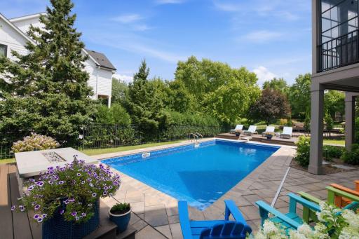 Exceptional setting for outdoor entertaining, relaxation and ambiance with a gas stone fireplace, 30x13 patio, 32x16 heated pool and two raised maintenance-free decks (20x14 & 14x14)