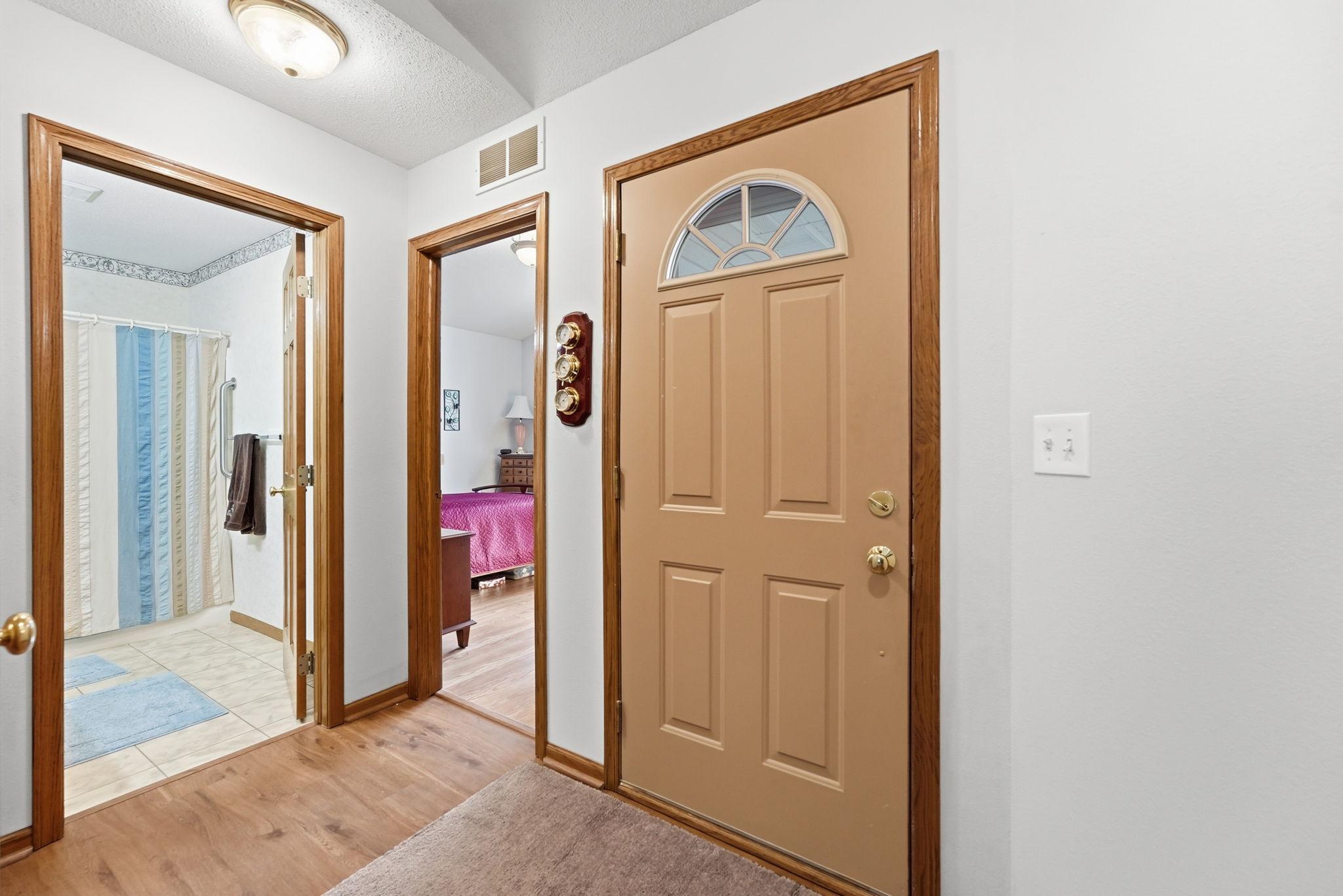 A cozy entryway welcomes you home with comfort and character.