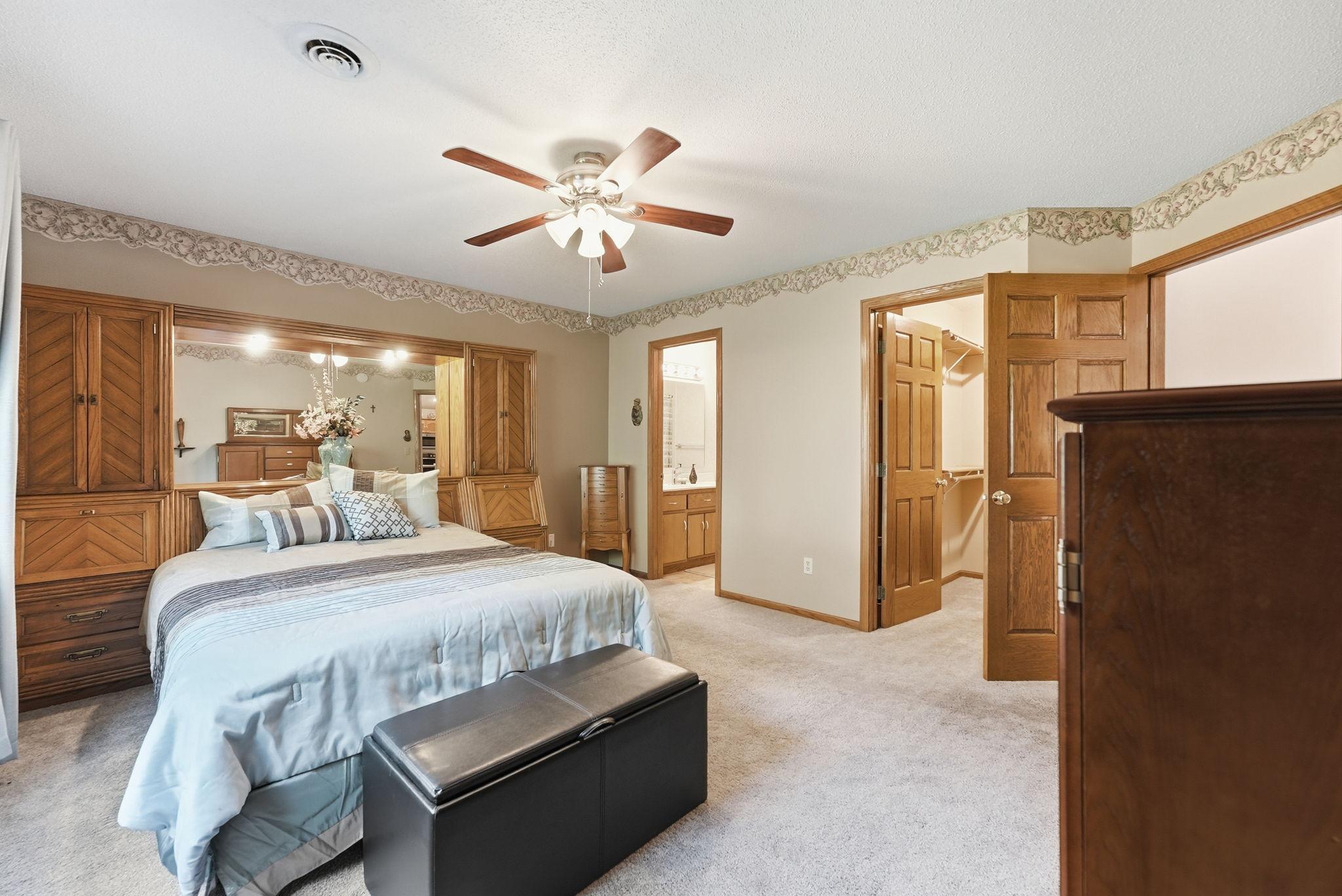 Features a walk in closet and full bathroom.