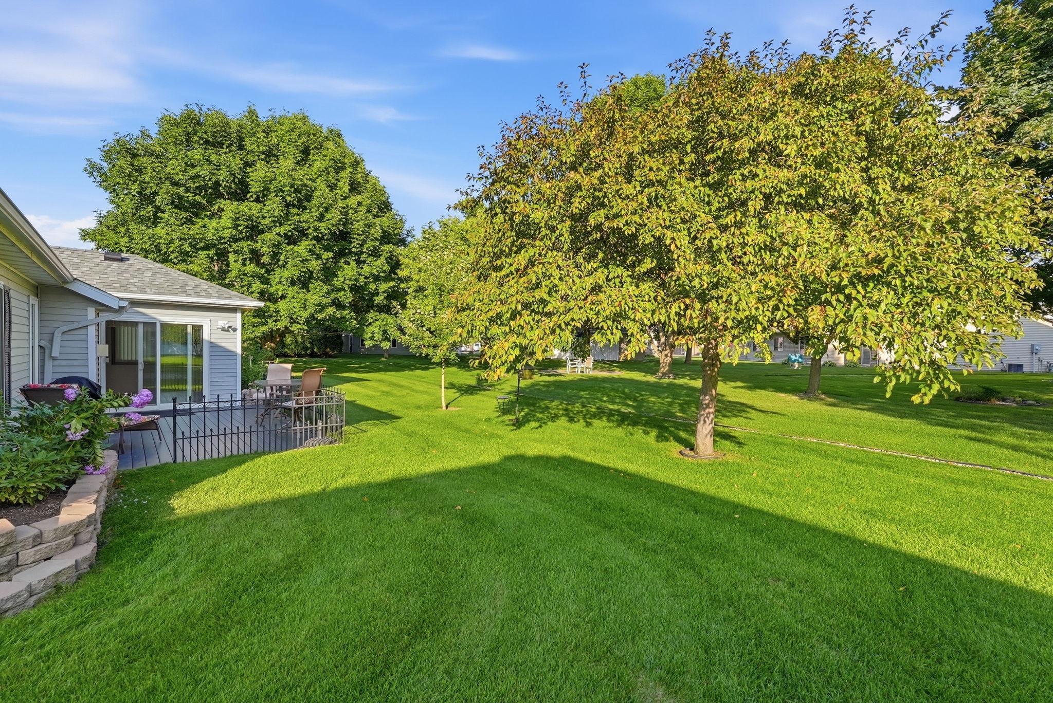 Well-maintained landscaping complements the home's exterior beautifully.