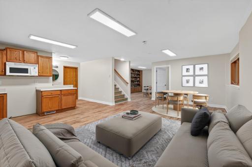 Lower level living room/dining area - virtually staged