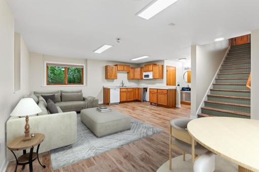 Lower level living room/dining area - virtually staged