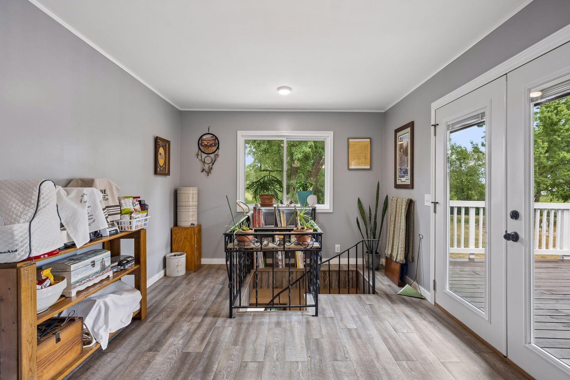 This room could be an office, sitting room or craft space! The spiral stairway is a secondary stairway to the lower level.