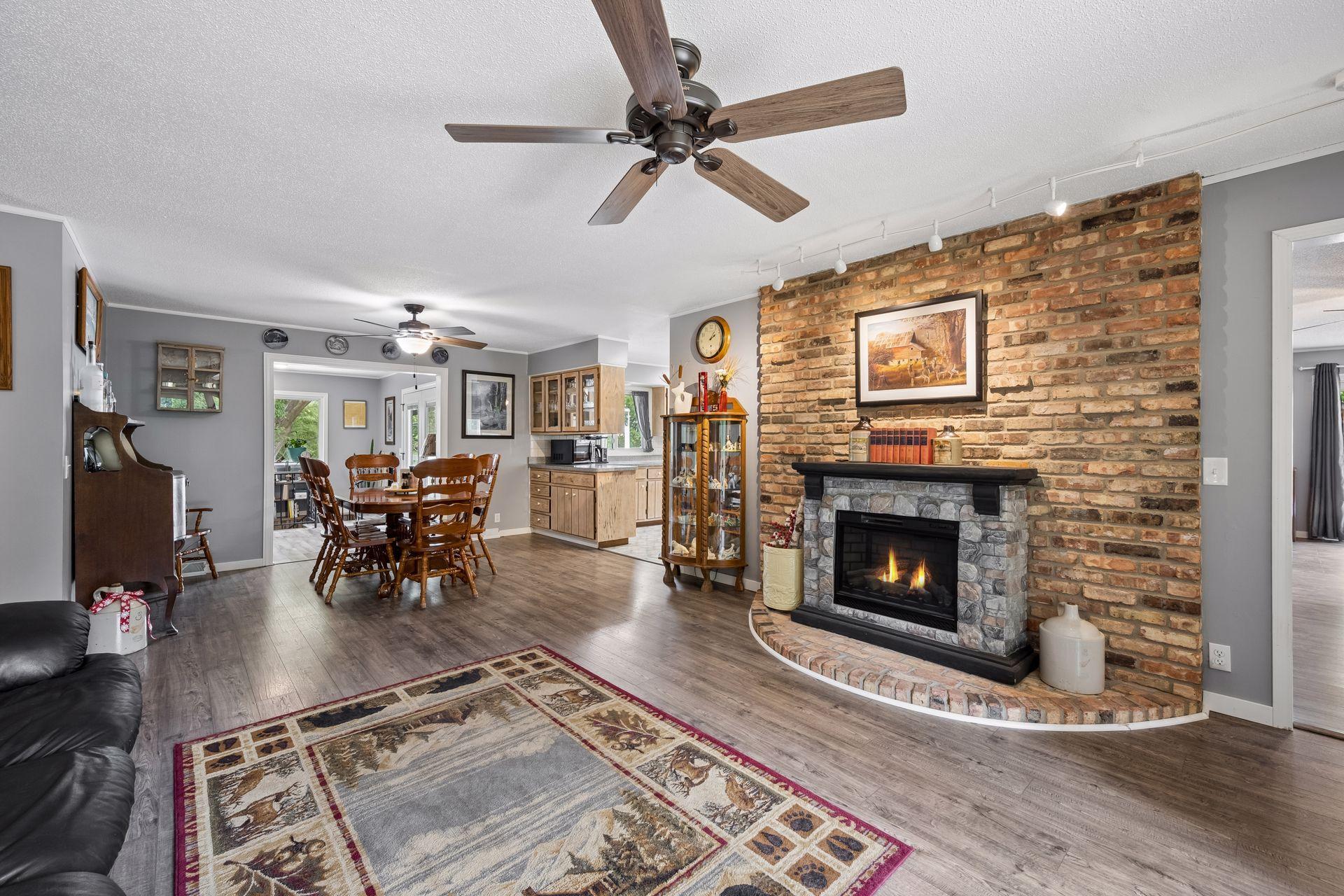 Beautiful brick with an electric fireplace.