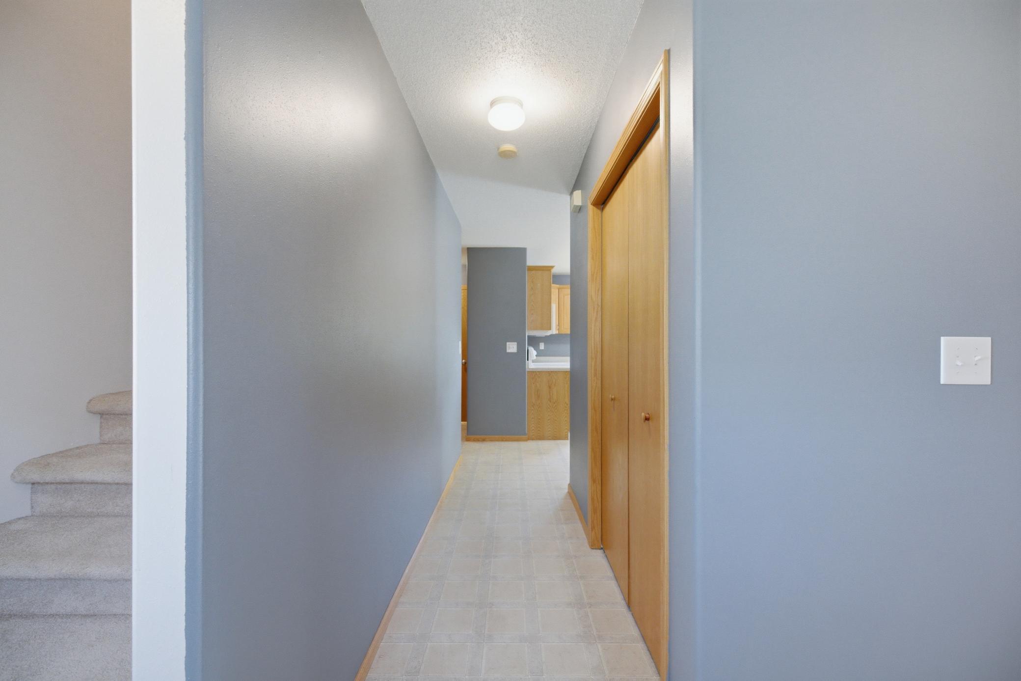View to Kitchen & Garage entry hallway from Foyer