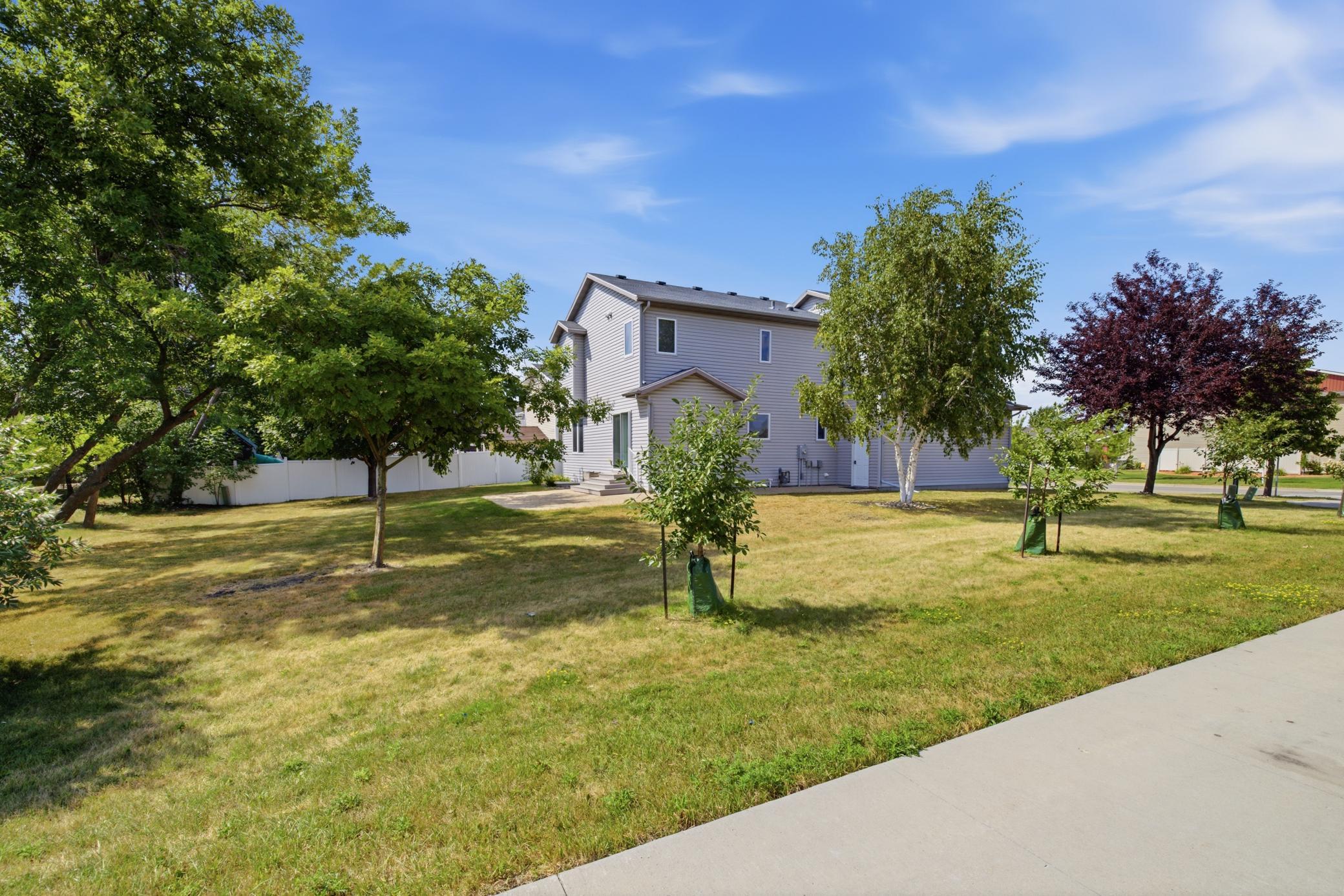 Large backyard, concrete patio, treed and shaded
