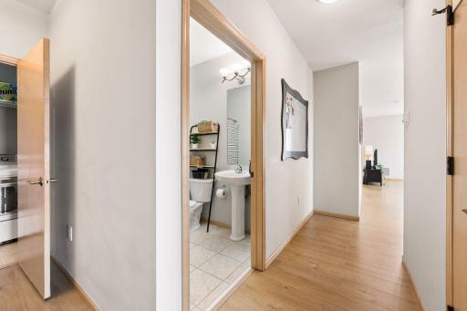 Hallway with easy access to the bath and open flow into the main living area.