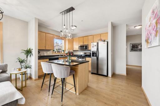 Spacious kitchen with center island, ample cabinetry, and generous prep space.