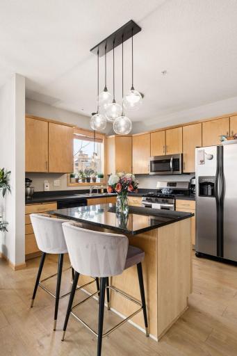 Open-concept living area with large windows, natural light, and modern finishes.