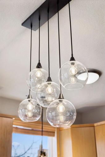 Statement pendant lighting adds a modern touch above the center island.