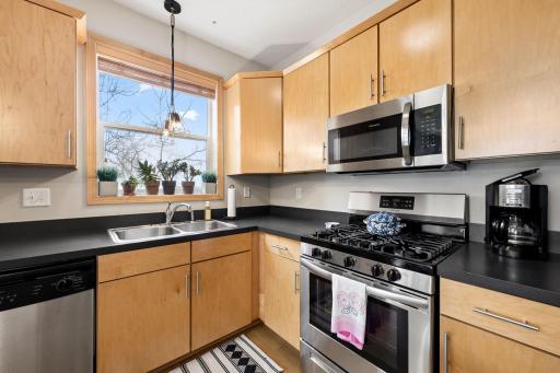 Well-appointed kitchen with gas range, stainless appliances, and plenty of cabinet space.