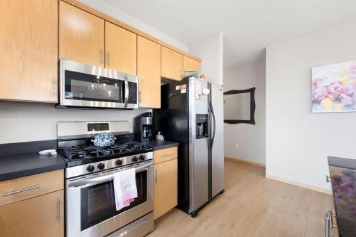 Additional kitchen view showcasing the efficient layout and abundant storage.