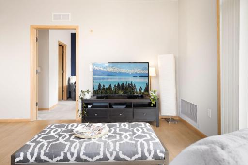 Comfortable living space with oversized windows and a bright, open feel.