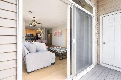 Balcony access just off the living area creates a seamless indoor-outdoor connection.