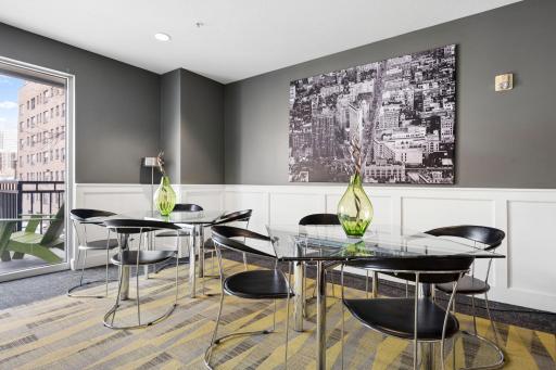 Community entertaining space with dining tables and a modern, inviting design.