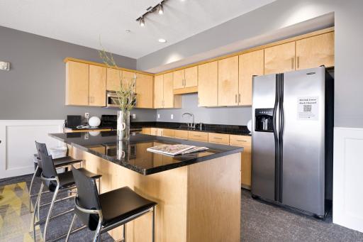 Additional community kitchen and serving area ideal for hosting larger events.