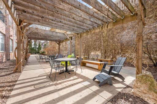 Additional community patio space with inviting seating and a peaceful outdoor setting.