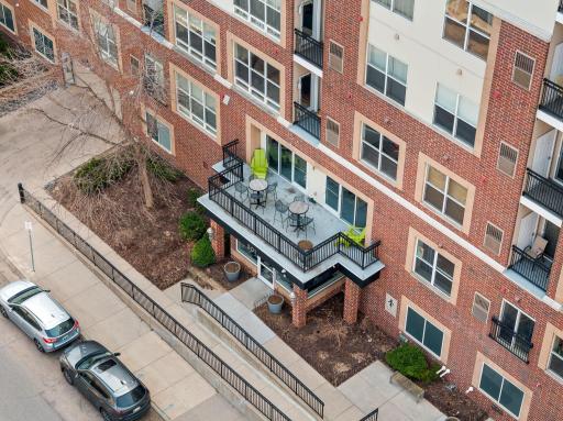 Elevated view of the front patio and main entrance to the building.