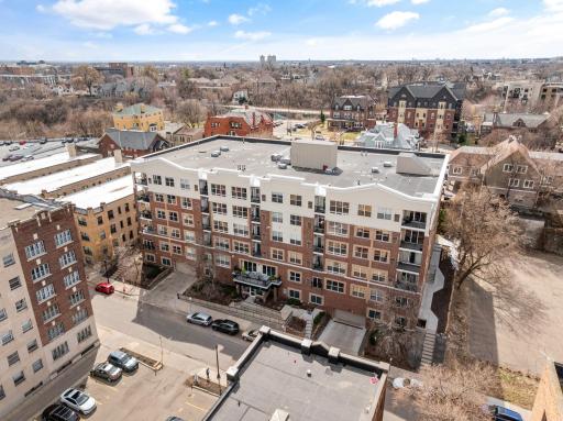 Aerial view showcasing the building’s central location surrounded by city amenities.