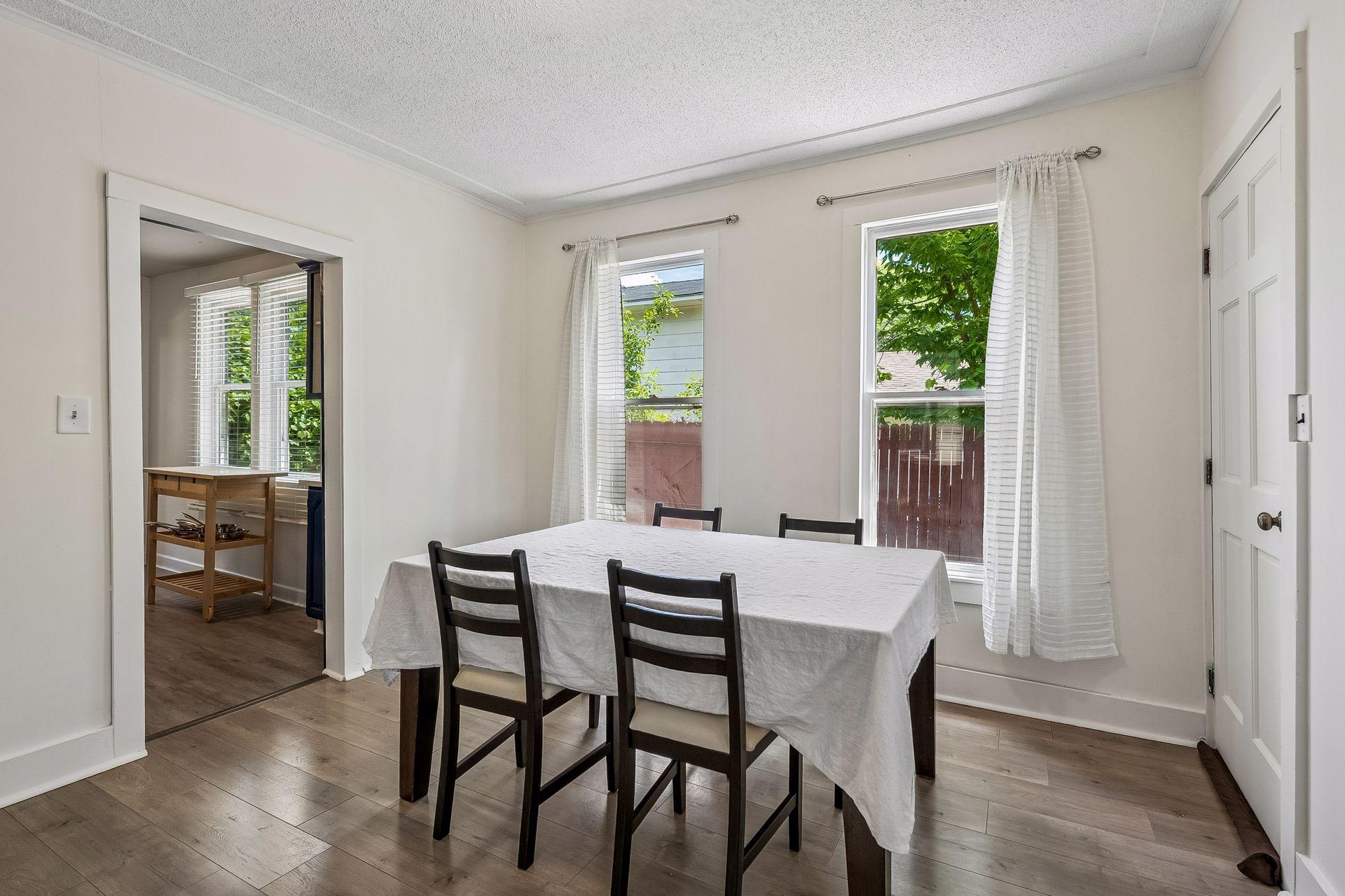 Spacious and sun filled formal dining space with adjacent storage closet.