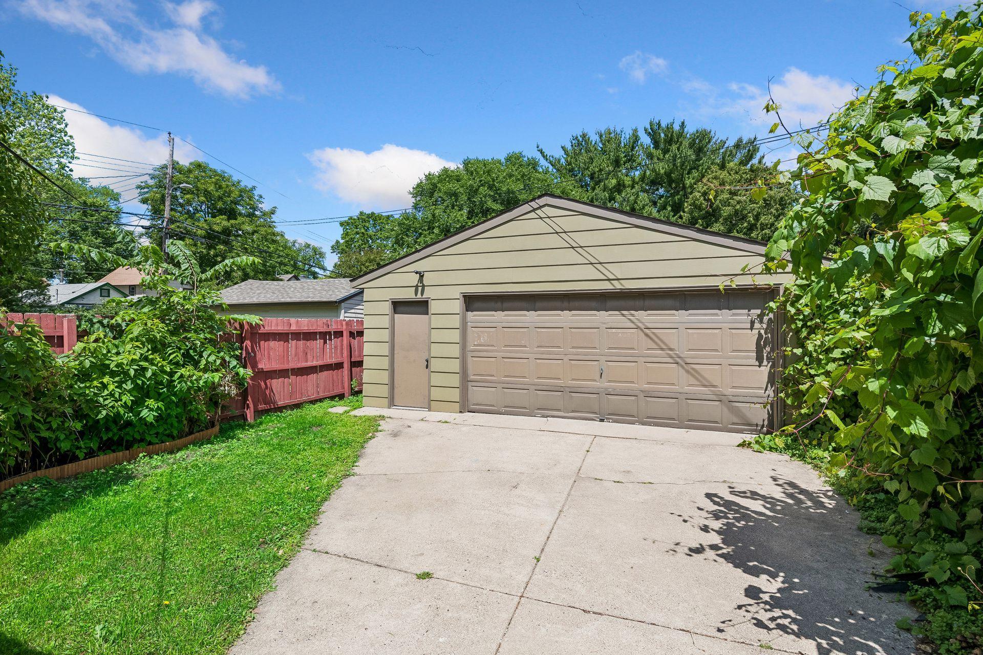 A rare and valuable find for this neighborhood - full driveway with oversized 2 car garage. No alley!