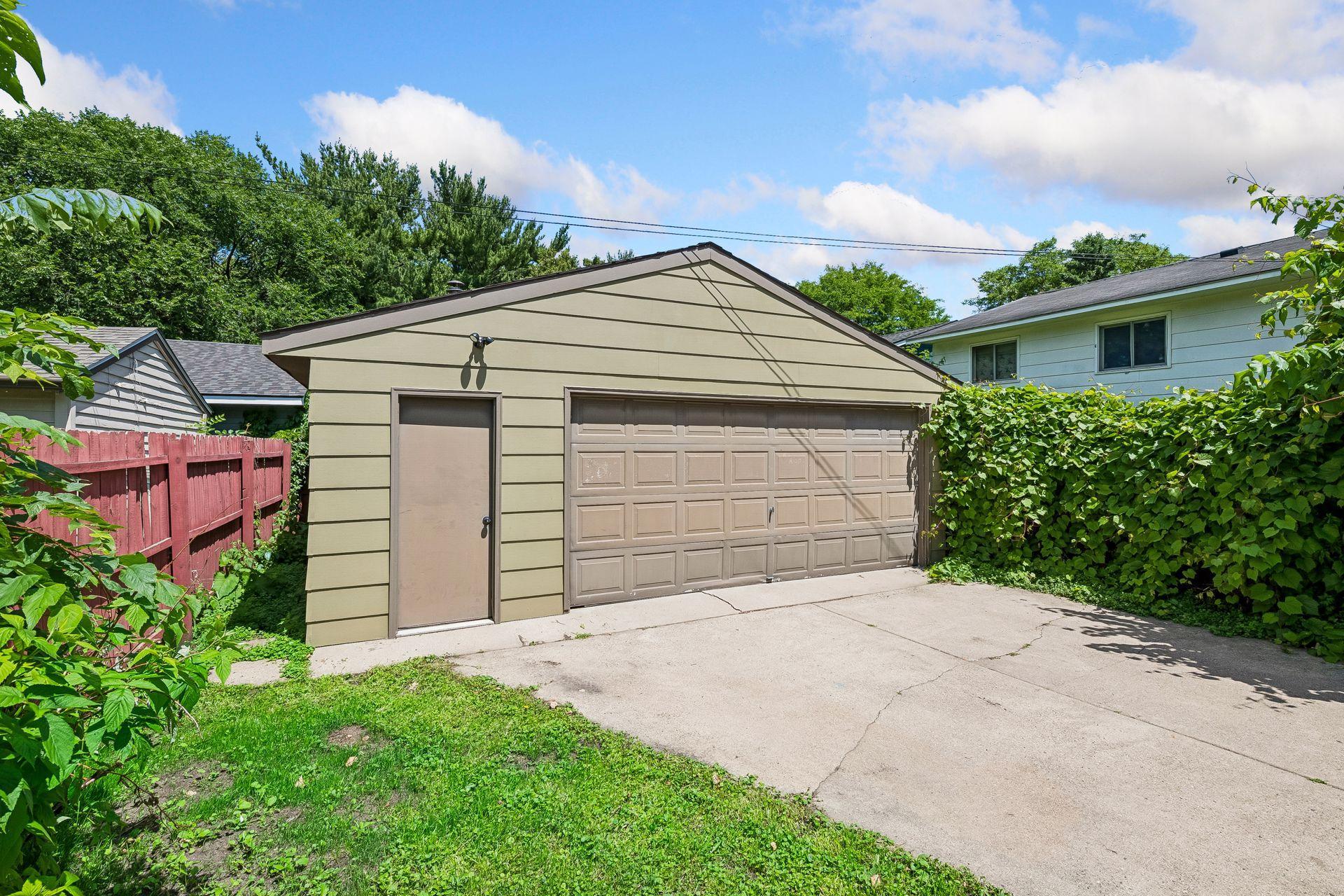 Exterior garage siding painted in 2026.