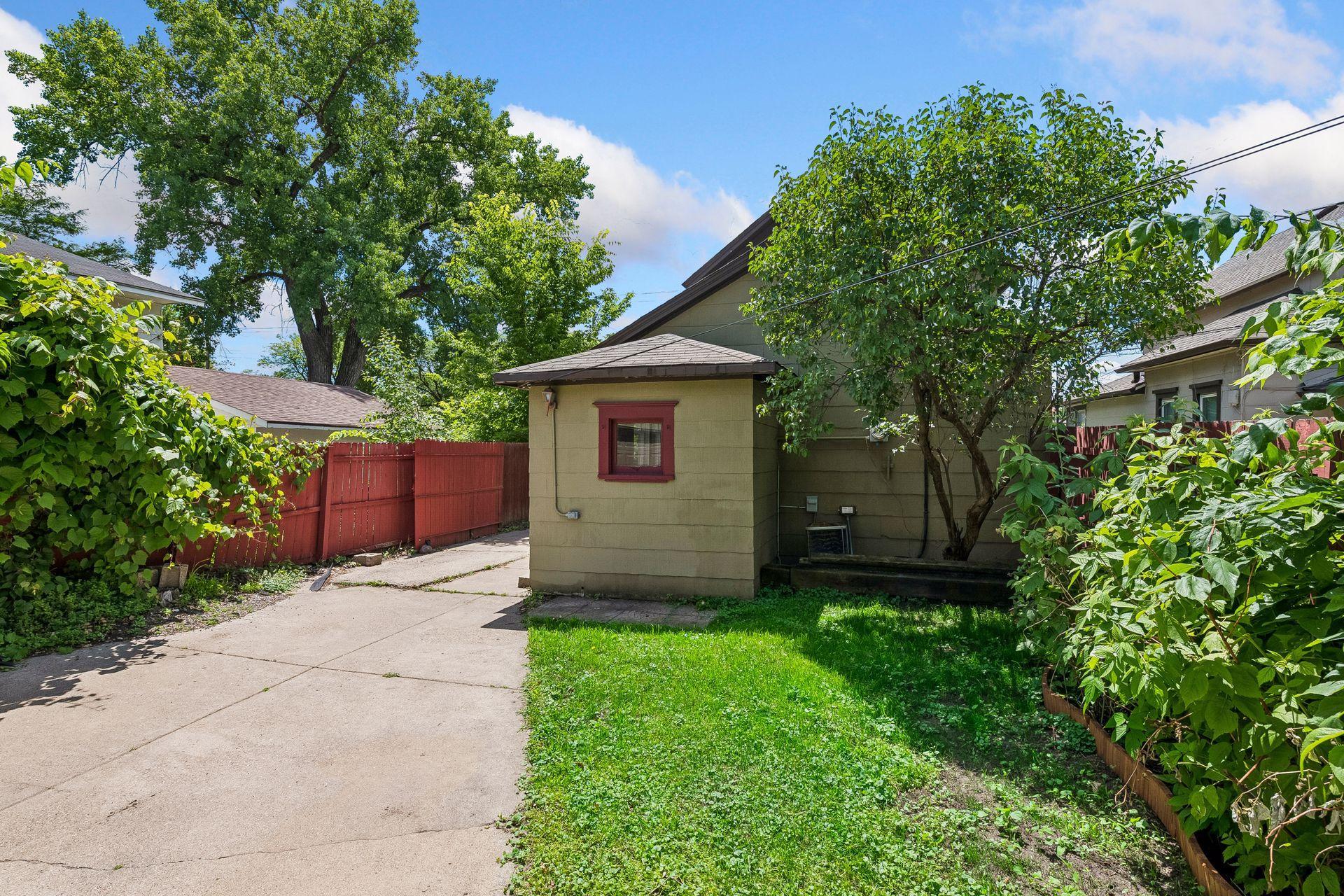 Backyard is fully fenced with a roll gate that closes off the driveway.