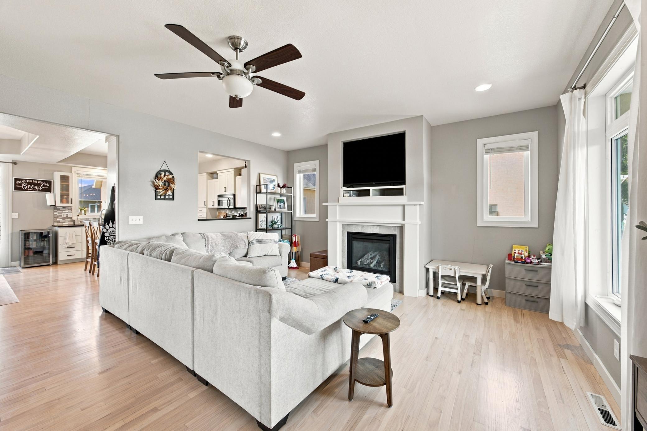 Bright living area with hardwood floors and gas fireplace