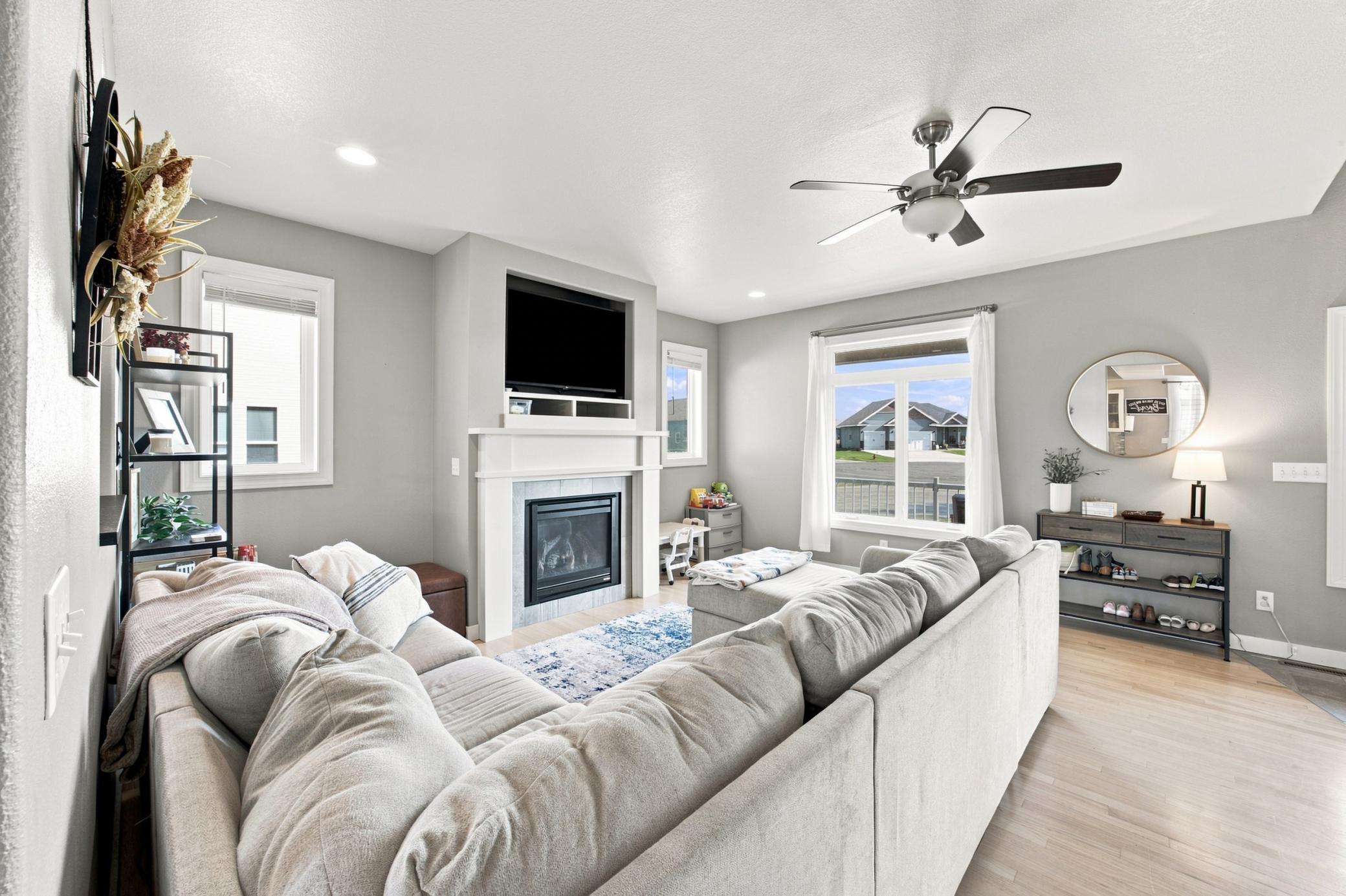 Living area with recessing lighting and gas fireplace