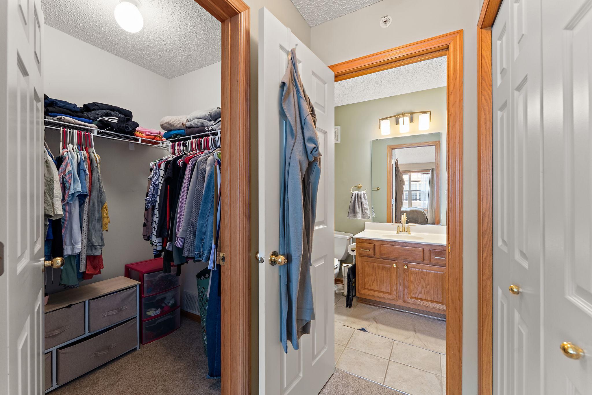 Primary suite walk in closet to walk through bath!