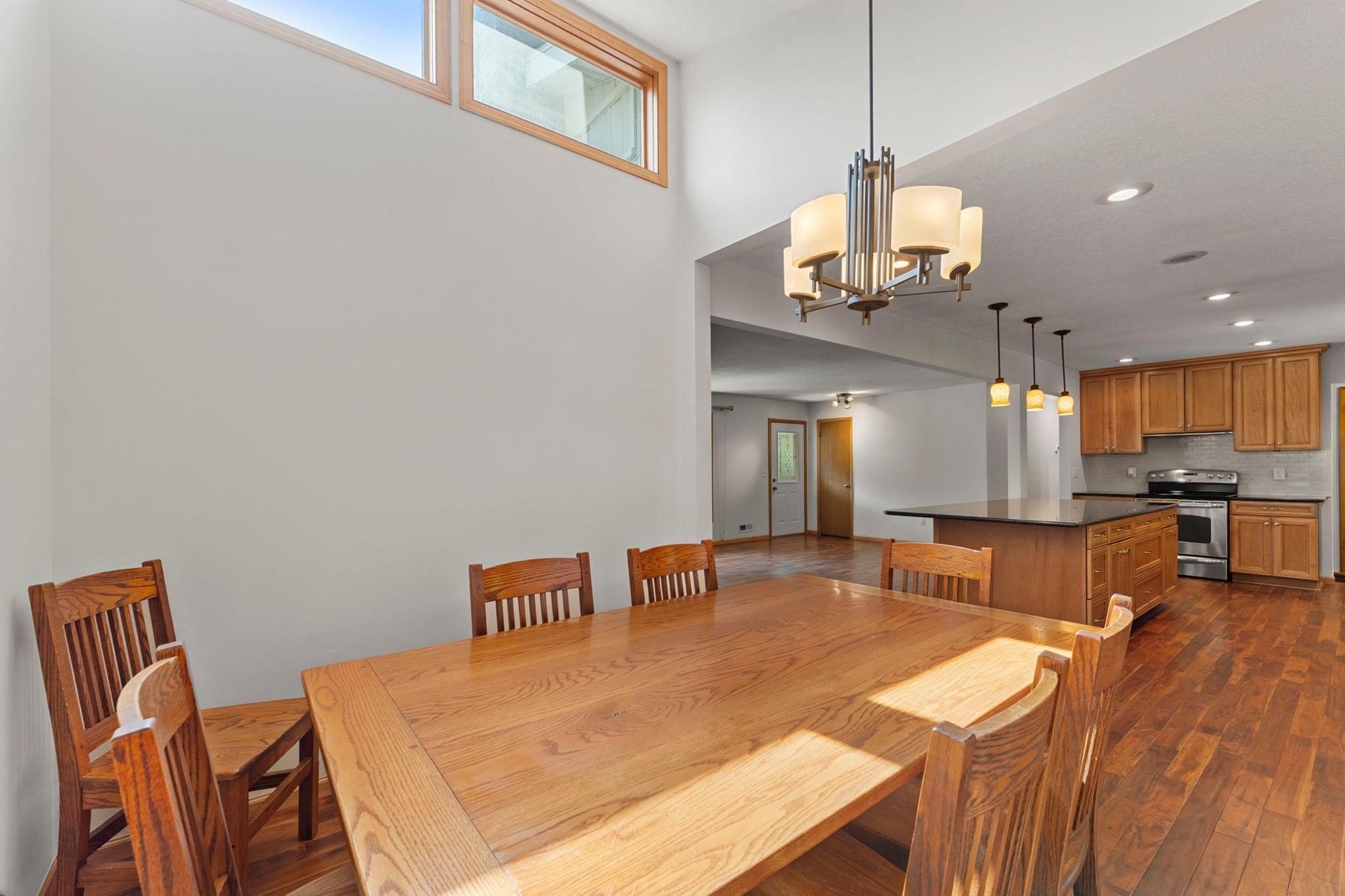 The dining area has a distinct presence of its own, highlighted by 11-ft ceilings and plenty of natural light.